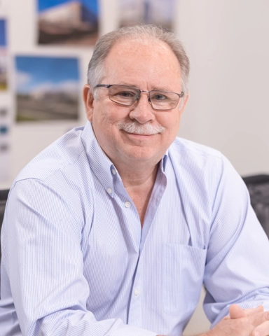 portrait of a smiling person in professional attire